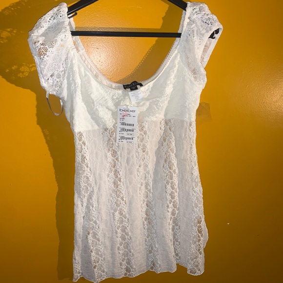 Never before worn tags on BEBE BABY DOLL TOP !! - Picture 1 of 3